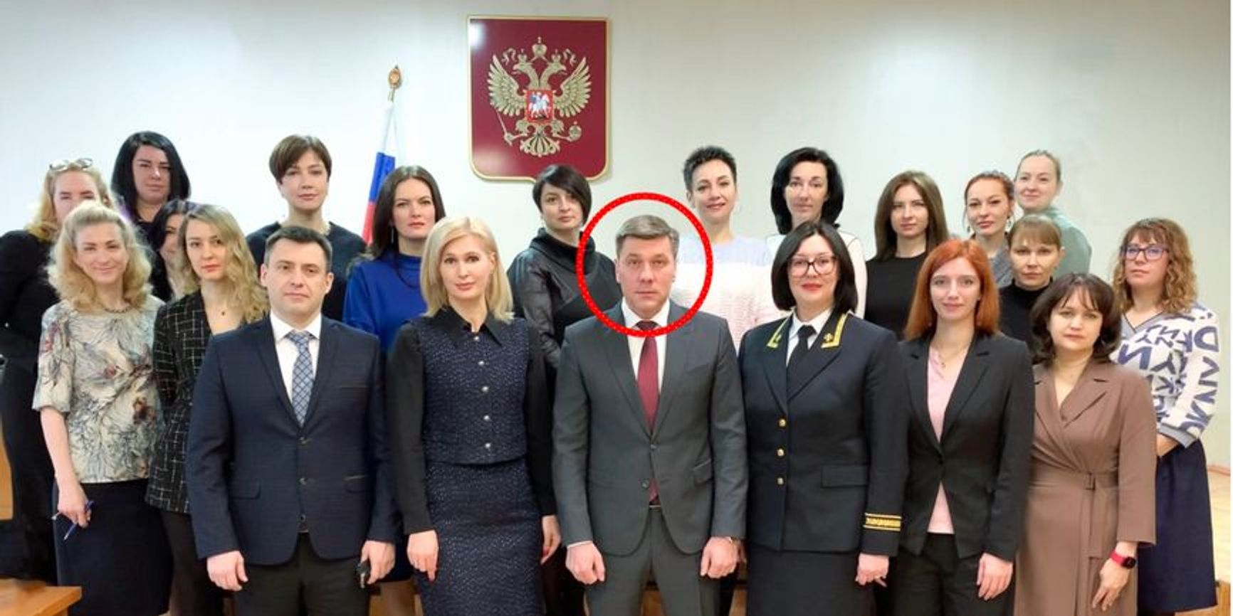 Niklay Ezhov, center, in a group photo with local government officials in Magadan. Offical government photo.